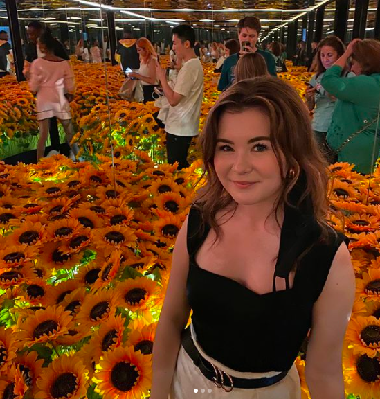 Chloe infront of Sunflower setting